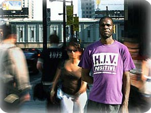 pedestrian wearing 'HIV Positive' t-shirt